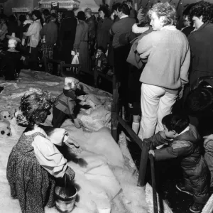 Parents and children queue to see Santa in his grotto at Blackers store in Liverpool