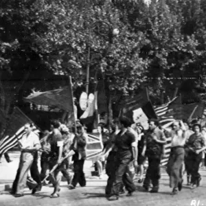 Partisans of Aix, in Southern France, stage a welcoming parade for liberating forces of