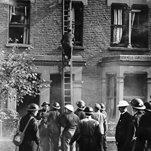 A party of rescue workers part of the ARP seen here checking houses damage by blast for