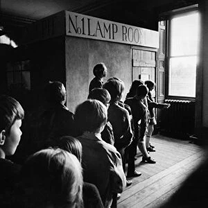 A party of schoolchildren wait their turn to enter the "pit"