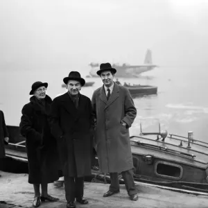 Passengers about to board launch taking them to a BOAC trans atlantic Empire Flying boat