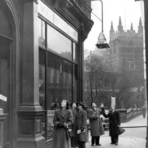 Passers-by looking up at the gas heaters outside the Northern Gas Board showrooms in Passers-by looking up at the gas heaters outside the Northern Gas Board showrooms in