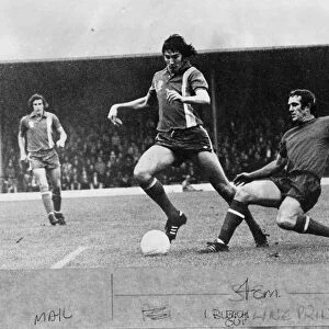 past a challenge during the game v Colchester United - 15th November 1975