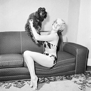 Pat Bolton seen here with her pet poodle dog. 1964 E298-001
