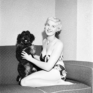 Pat Bolton seen here with her pet poodle dog. 1964 E298-002