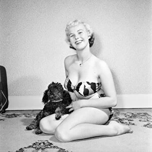 Pat Bolton seen here with her pet poodle dog. 1964 E298-004
