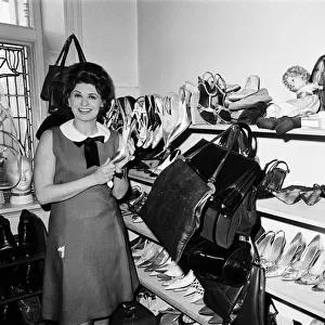 Pat Phoenix at home with her shoe collection. 16th April 1968