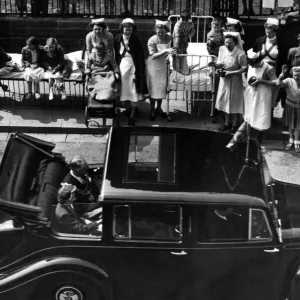 Patients from the Childrens Hospital watch Princess Elizabeth as she passes through Patients from the Childrens Hospital watch Princess Elizabeth as she passes through