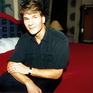 Patrick Swayze actor October 1992. Sitting on bed