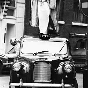 Patti Boulaye singer Standing on top of a taxi celebrating after winning Singer of
