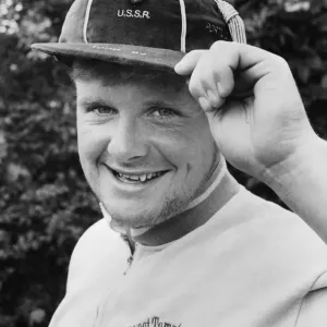 Paul Gascoigne proudly displays one of his under 21 caps as well as a touch of designer