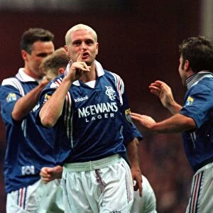Paul Gascoigne of Rangers Football Club holds his finger up to his mouth during