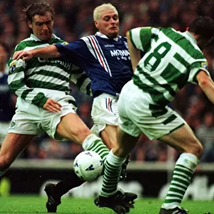 Paul Gascoigne of Rangers is tackled by Peter Grant of Celtic in the Scottish Premier