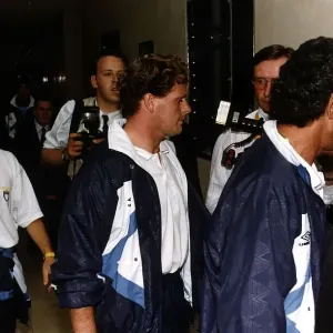 Paul Gascoigne surrounded by phpotographers and reporters after he walked silently out of