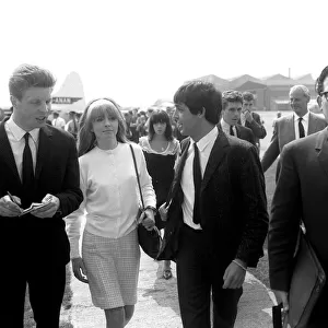 Paul McCartney and actress Jane Asher arriving at Luton Airport, May 1964