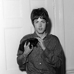 Paul McCartney of The Beatles holding a kitten at his home on his 25th birthday 18 June