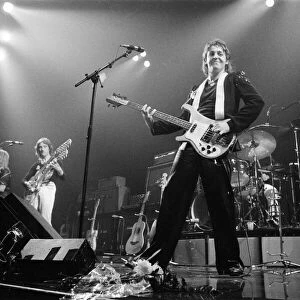 Paul McCartney, formerly of The Beatles, singing with Denny Laine of their group Wings
