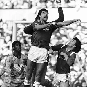 Paul McGrath of Manchester United jumps up for a high ball during his side