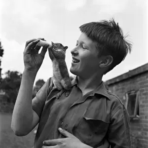 Paul Tautz, aged 12, of 10, Dorking Road, Epsom, is seen with his pet Squirrel John Willy