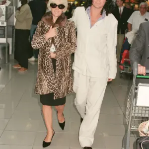 Paula Yates and her boyfriend, INXS singer Michael Hutchence leave Heathrow Airport for