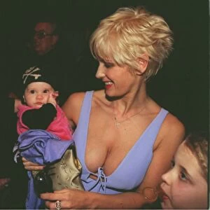 Paula Yates with daughters Heavenly Hiraani and Peaches at the Versace fashion show for