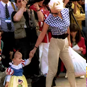 Paula Yates TV Presenter and Model with daughter at Eurodisney