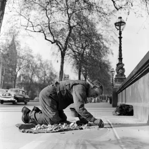 Pavement Artist at work on the Embankment, London. Circa 1945 Pavement Artist at work on the Embankment, London. Circa 1945