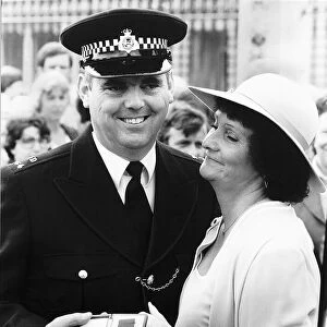 PC Trevor Lock with his wife Doreen outside Buckingham Palace after being presented with