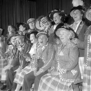 Pearly kings and queens singing during a concert Pearly kings and queens singing during a concert