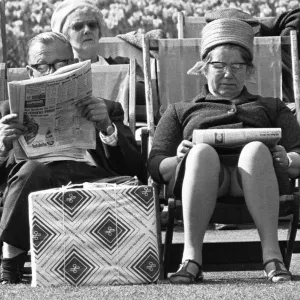 Pensioners reading the newspaper whilst enjoying the afternoon sun in Embankment Gardens Pensioners reading the newspaper whilst enjoying the afternoon sun in Embankment Gardens