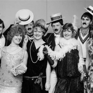 People celebrating New Years Eve at a Roaring Twenties party