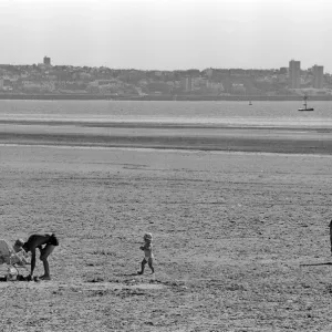 People enjoying a day at Crosby beach. Crosby, Merseyside. 1st August 1990
