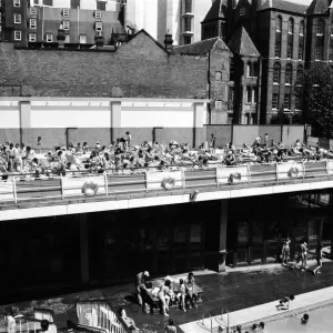 People enjoying the hot weather at the Oasis outdoor swimming pool Lido, London