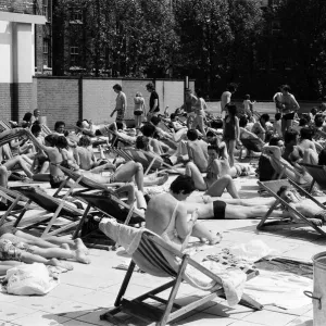 People enjoying the hot weather at the Oasis outdoor swimming pool Lido, London