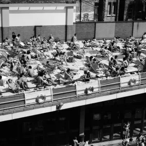People enjoying the hot weather at the Oasis outdoor swimming pool Lido, London