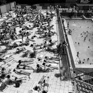 People enjoying the hot weather at the Oasis outdoor swimming pool Lido, London
