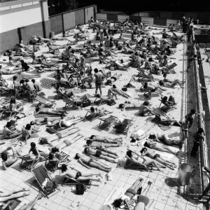 People enjoying the hot weather at the Oasis outdoor swimming pool Lido, London