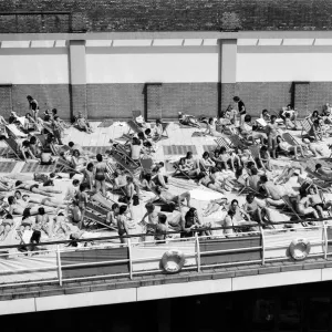People enjoying the hot weather at the Oasis outdoor swimming pool Lido, London