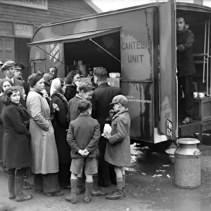 People gather around the mobile canteen van situated at the Salvation Army in Coventry