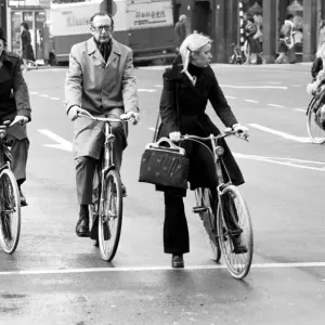 People getting around the town by bicycle in Rotterdam, Holland. May 1975 People getting around the town by bicycle in Rotterdam, Holland. May 1975