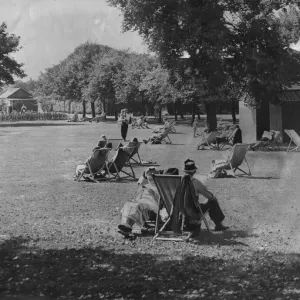 People relaxing in the summer sunshine at Exhibition Park in Newcastle People relaxing in the summer sunshine at Exhibition Park in Newcastle