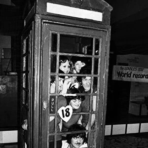 Twenty people set a record for squeezing into a telephone box. January 1978