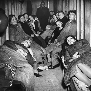 People sheltering in air raid shelter. 30th September 1940 first two people