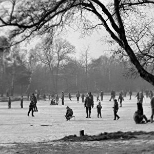 People skating on a frozen lake during a particularly cold winter in February 1963