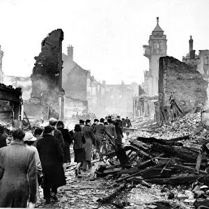 People walking through Coventry after air raid Nov 1940 WW2