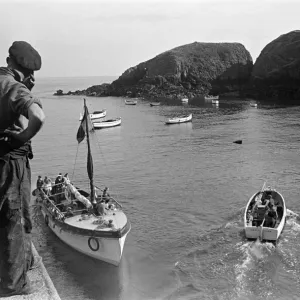 People watch the boats off the coast of Sark, Channel Islands. July 1947 People watch the boats off the coast of Sark, Channel Islands. July 1947