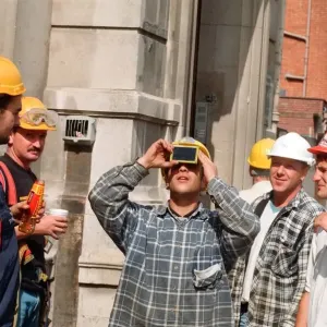 People watching a total solar eclipse, Queen Street, Cardiff. 11th August 1999