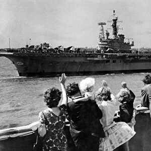 People waving at the visiting aircraft carrier HMS Centaur. Liverpool, Merseyside