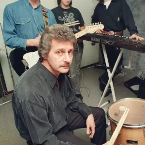 Pete Best, (in the black shirt holding his drum sticks) posing for the camera with his