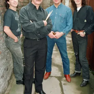 Pete Best, (in the black shirt holding his drum sticks) posing for the camera with his